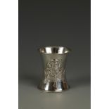 OMAR RAMSDEN: A NAPKIN RING of waisted cylindrical form, decorated with an embossed Tudor rose,