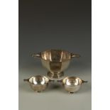 A PEDESTAL BOWL of octagonal form with pierced lug handles, on an octagonal foot, by William