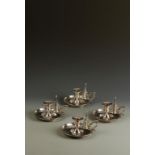 ROYAL INTEREST: A SET OF FOUR VICTORIAN CHAMBERSTICKS with pull-off conical snuffers, circular