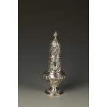 A VICTORIAN SUGAR CASTOR of baluster form with a high pierced pull-off cover, flame finial and