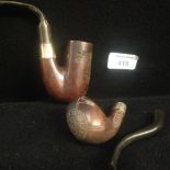 Two pipes with carved wooden bowls