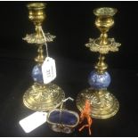 A pair of gilt brass candlesticks, a ceramic basket and a small figure of a devil