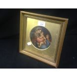 A framed painting of the Holy Family, possibly an over painted print