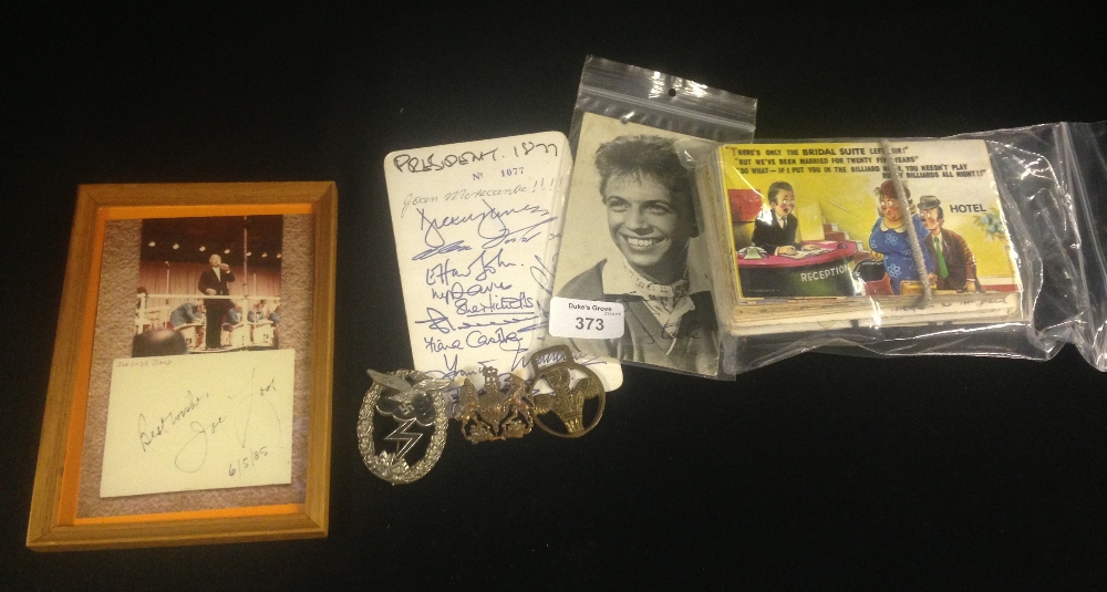 A quantity of photographs and postcards including an autograph from Joe Loss, a Nazi badge and two