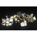 A collection of miniature ceramic ornaments including animals