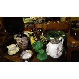 Susie Cooper: A green glazed pottery bowl, a Susie Cooper jug and saucer, a Victorian pottery teapot