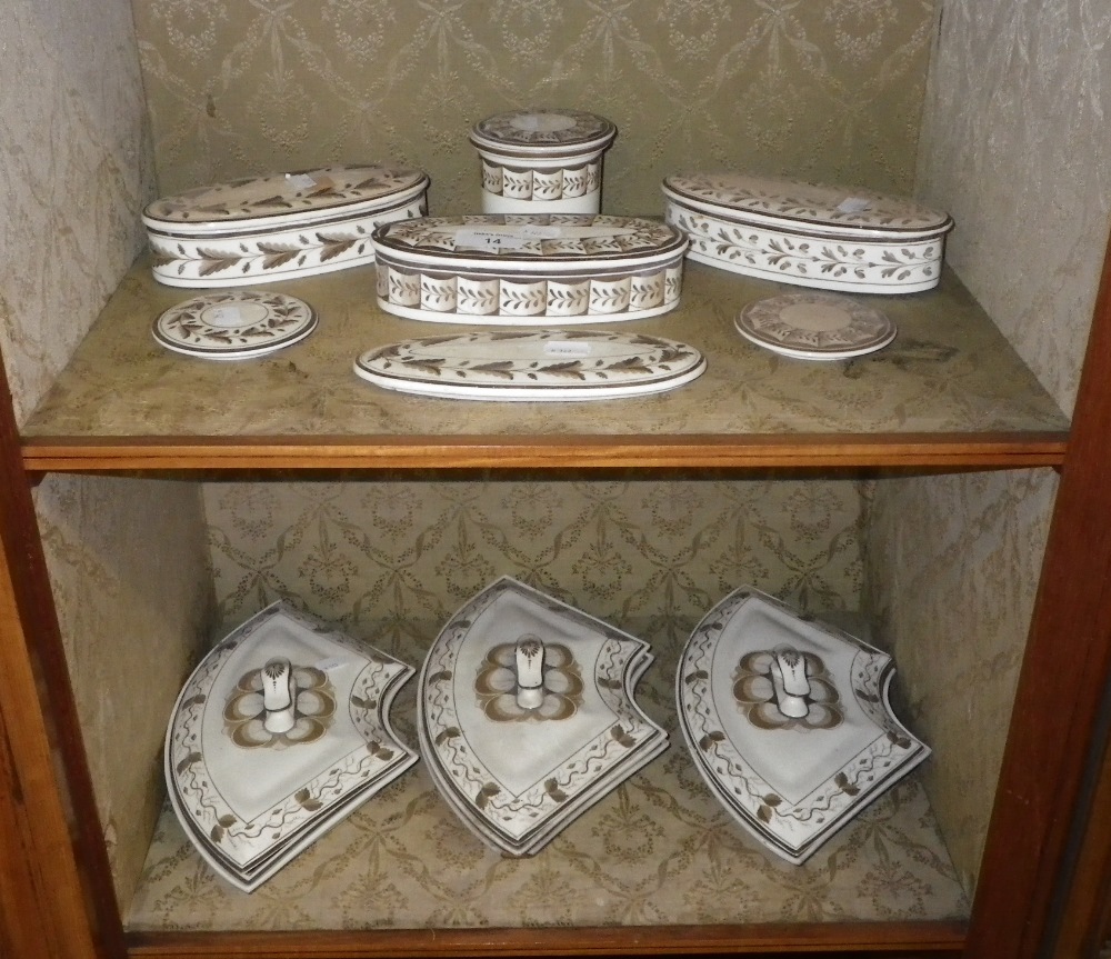 A collection of 19th century ceramic dressing jars with hand painted decoration and three 19th