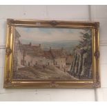 Douglas H Chaffey: An oil on canvas study of a cobbled street with houses in gilt frame