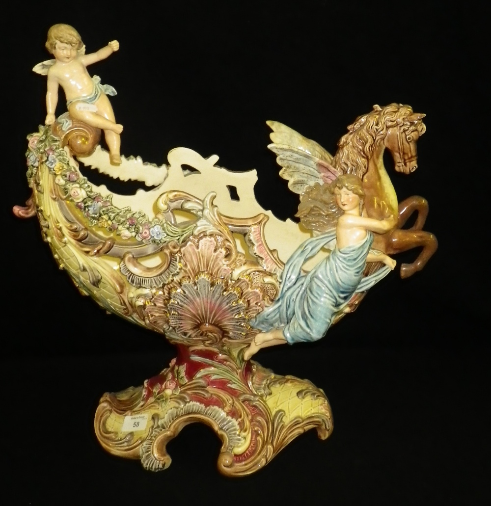 A large early 20th century German ceramic centrepiece decorated with a winged horse and figures