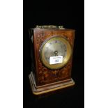 A 19th century inlaid rosewood table clock with a silvered dial and brass handle