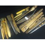 A collection of carved wooden and similar letter openers and page turners