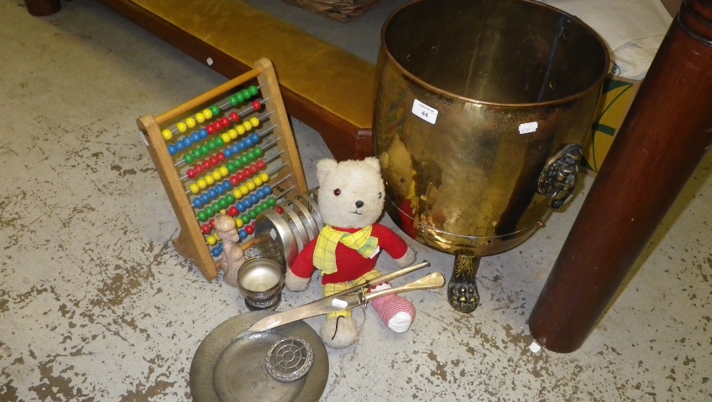 A brass footed coal scuttle with lion-mask handles, a vintage Rupert Bear and similar items