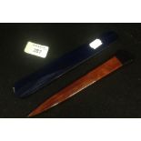 An Art Deco style letter opener and a stained blue 'agate' letter opener