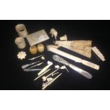 A quantity of ivory items including letter opener, napkin rings and other items