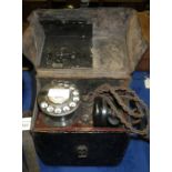 A vintage GPO telephone engineers mobile testing set, with dial and headset, in a fitted leather