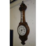 A late Victorian oak banjo barometer