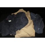 A vintage warehouseman's coat and two shorter GPO jackets