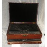 A leather covered jewellery case with various fitted trays
