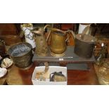 A Victorian brass watering can, two brass water jugs, horse brass and other metalware