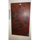 An Oriental red lacquered panel