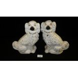 A pair of Victorian Staffordshire pottery Spaniels