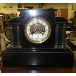 An Edwardian black slate-cased mantel clock of architectural form