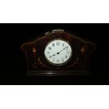 An Edwardian mahogany mantel clock with inlaid decoration