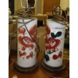 A pair of Japanese porcelain table lamps with painted Dog of Fo decoration