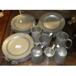 A set of six 19th century pewter warming plates and a selection of pewter tankards