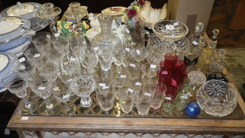 A set of eight cut-glass wine goblets and a collection of decorative glassware