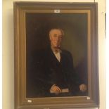 A Victorian oil on canvas portrait of a seated gentleman holding a scroll in gilt frame