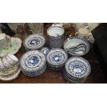 A large quantity of Oriental blue and white gilt decorated rice bowls, dishes and similar ceramics