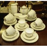 A 1930's Art Deco style Doulton tea service in white with silvered banded decoration