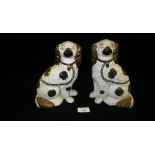 A pair of Victorian Staffordshire pottery Spaniels