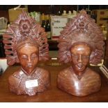 Two Asian carved wood busts of a male and female in headdress