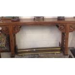 A Chinese hardwood altar table with carved decoration and fretwork sides