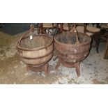 A pair of rare Chinese hardwood water buckets on stands with wrought-iron fittings