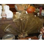 A Victorian style brass fan fire screen