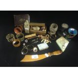 A collection of assorted items including a miniature serpentine mounted sundial