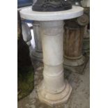 A circular marble plinth