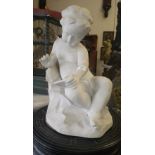 A reconstituted marble study of a young boy writing, 18" high