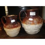 A 19th century stoneware 'Harvesting' jug and another similar