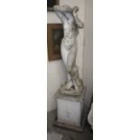 A reconstituted stone study of a scantily clad maiden on a square plinth, 66.5" high