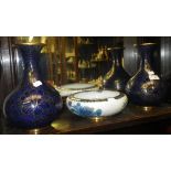 A pair of royal blue cloisonné vases and a similar bowl