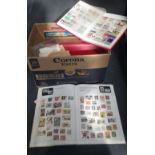 A quantity of assorted stamp albums containing various stamps and further loose stamps