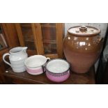 A large glazed stoneware storage jar, two chamber pots and a large white glazed jug