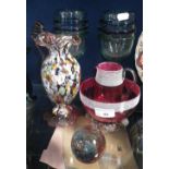 A cranberry glass sucrier and jug, a millifiore jug and similar glassware