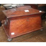 A 19th century figured mahogany tea caddy of sarcophagus form  with fully fitted interior