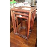 A nest of three miniature Chinese hardwood tables