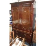 A George III mahogany linen press, two drawers below, fitted a brushing slide, c.80" high x 47"